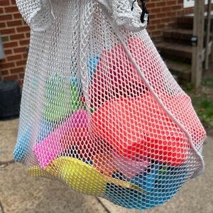 Mesh bag full of Beach/Bath Plastic Toys